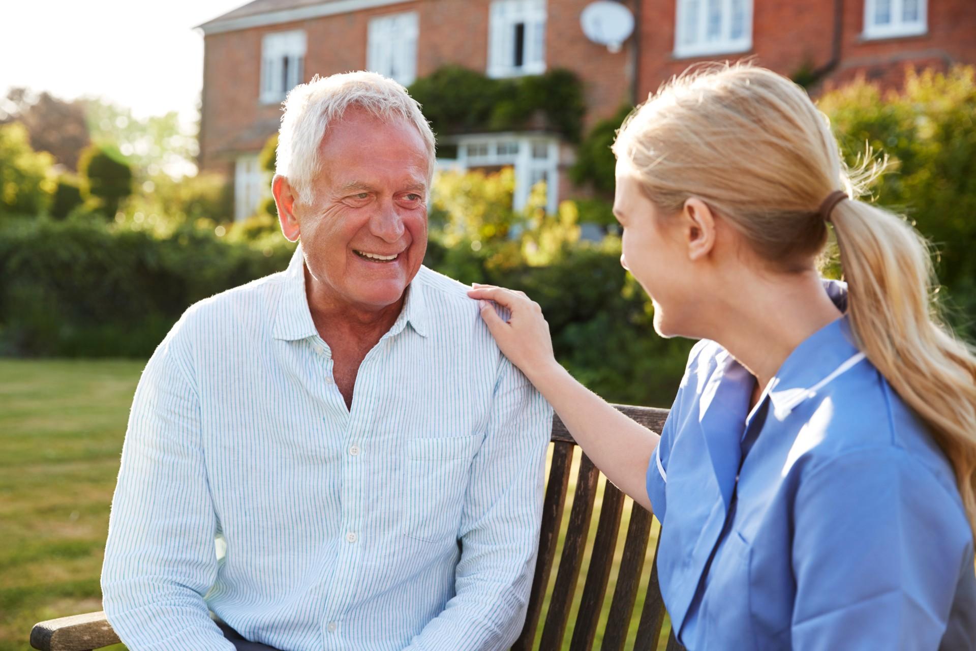 nurse-talking-to-senior-man-in-residential-care-home